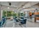 Dining area with a large table, modern seating, and a connected kitchen area at 1 E Lexington Ave # 1211, Phoenix, AZ 85012