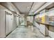 Hallway with elevators, tile floors, and decorative artwork at 1 E Lexington Ave # 1211, Phoenix, AZ 85012