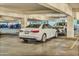 Parking garage with modern vehicles parked in designated spots at 1 E Lexington Ave # 1211, Phoenix, AZ 85012