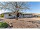 Charming single-story home with a well-kept yard and neutral color palette at 11265 E Laguna Azul Cir, Mesa, AZ 85209