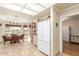 Open kitchen with a dining area and a view of the backyard through large windows at 11265 E Laguna Azul Cir, Mesa, AZ 85209