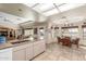 Bright kitchen with a breakfast nook and a pass-through to the living area at 11265 E Laguna Azul Cir, Mesa, AZ 85209