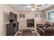 Cozy living room features tile floors and ample natural light at 11265 E Laguna Azul Cir, Mesa, AZ 85209