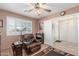 Comfortable living room features tile floors, a ceiling fan, and neutral paint at 11265 E Laguna Azul Cir, Mesa, AZ 85209