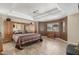 Spacious main bedroom featuring a tray ceiling, mirrored built-ins, and neutral colors at 11265 E Laguna Azul Cir, Mesa, AZ 85209