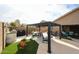 Entertain in this backyard featuring a covered patio, outdoor kitchen, and seating area for lounging at 12622 W Avalon Dr, Avondale, AZ 85392