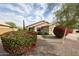 Beautiful single-Gathering home featuring a well-manicured lawn, desert landscaping, and a welcoming entrance at 12622 W Avalon Dr, Avondale, AZ 85392