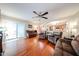 Bright living room features hardwood floors and an open concept flowing into dining area at 12622 W Avalon Dr, Avondale, AZ 85392