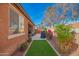 Manicured backyard with stone walkway and lush landscaping provide privacy and charm at 13108 N 91St N Ln, Peoria, AZ 85381