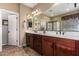 Bathroom featuring a double vanity, tile floors, and walk-in glass shower at 13108 N 91St N Ln, Peoria, AZ 85381