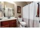 Classic bathroom with a vanity, toilet, and shower with a curtain at 13108 N 91St N Ln, Peoria, AZ 85381