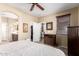 Cozy bedroom featuring neutral tones, walk-in closet, and en-suite bathroom at 13108 N 91St N Ln, Peoria, AZ 85381