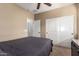 Bedroom featuring neutral tones, closet, and bright, natural lighting at 13108 N 91St N Ln, Peoria, AZ 85381