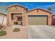 Charming single-story home with stone accents, a two-car garage, and desert landscaping at 13108 N 91St N Ln, Peoria, AZ 85381