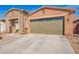 Charming single-story home with stone accents, a two-car garage, and desert landscaping at 13108 N 91St N Ln, Peoria, AZ 85381