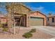 Charming single-story home with stone accents, a two-car garage, and desert landscaping at 13108 N 91St N Ln, Peoria, AZ 85381