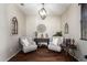 Charming sitting room with decorative chandelier, complemented by elegant chairs, side tables, and wooden floors at 13108 N 91St N Ln, Peoria, AZ 85381