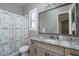 Bathroom with granite countertops and decorative mirror at 15233 W Baden St, Goodyear, AZ 85338