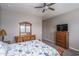 Comfortable bedroom includes a wooden dresser and TV, creating a relaxing personal space at 15233 W Baden St, Goodyear, AZ 85338