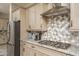 Modern kitchen showcasing stainless steel appliances, granite counters, and light wood cabinetry at 15233 W Baden St, Goodyear, AZ 85338