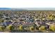 An aerial view of a desert community showing a variety of homes and mature trees at 15837 W Bonitos Dr, Goodyear, AZ 85395