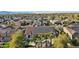 Stunning aerial view of a home featuring a red-tiled roof with solar panels and backyard oasis with a private pool at 15837 W Bonitos Dr, Goodyear, AZ 85395