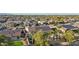 An aerial view of a desert community showing a variety of homes and mature trees at 15837 W Bonitos Dr, Goodyear, AZ 85395