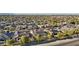 An aerial view of a desert community showing a variety of homes and mature trees at 15837 W Bonitos Dr, Goodyear, AZ 85395