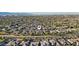 An aerial view of a desert community showing a variety of homes and mature trees at 15837 W Bonitos Dr, Goodyear, AZ 85395