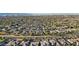 An aerial view of a desert community showing a variety of homes and mature trees at 15837 W Bonitos Dr, Goodyear, AZ 85395