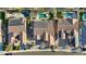 Aerial view of houses with tile roofs, solar panels, and swimming pools in backyard at 15837 W Bonitos Dr, Goodyear, AZ 85395