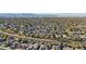 An aerial view of a desert community showing a variety of homes and mature trees at 15837 W Bonitos Dr, Goodyear, AZ 85395