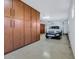 Well-organized garage with built-in cabinets and epoxy flooring at 15837 W Bonitos Dr, Goodyear, AZ 85395