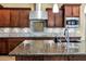 Spacious kitchen featuring granite countertops, a tile backsplash, and stainless steel appliances at 15837 W Bonitos Dr, Goodyear, AZ 85395