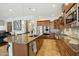 Open kitchen with large island, stainless steel appliances, and seamless transition into the living room at 15837 W Bonitos Dr, Goodyear, AZ 85395