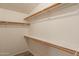 Walk-in closet with adjustable shelving creating great storage in this home at 1612 N 201St Ave, Buckeye, AZ 85396