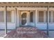 Close-up view of the home's entrance, showcasing the door and brick steps at 1612 N 201St Ave, Buckeye, AZ 85396