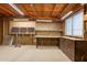 Large garage with exposed ceiling and work bench for projects and storage at 1612 N 201St Ave, Buckeye, AZ 85396