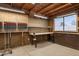 Spacious garage with exposed ceiling and work bench, perfect for storage and projects at 1612 N 201St Ave, Buckeye, AZ 85396