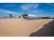 Wide open land featuring a metal shed and solar panels under a stunning blue sky at 1612 N 201St Ave, Buckeye, AZ 85396