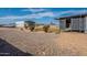 Expansive grounds featuring a metal shed, solar panels, gazebo and lawn under a beautiful blue sky at 1612 N 201St Ave, Buckeye, AZ 85396