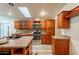 Spacious kitchen featuring custom cabinets, stainless steel appliances, and a bright skylight at 1612 N 201St Ave, Buckeye, AZ 85396