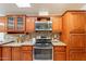 Well-lit kitchen featuring custom cabinets, modern appliances, and stylish countertops at 1612 N 201St Ave, Buckeye, AZ 85396