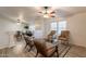 Comfortable living room with a ceiling fan and a smooth transition to the next living space at 1612 N 201St Ave, Buckeye, AZ 85396