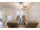 Bright living room with neutral walls, modern ceiling fan, and stylish furnishings at 1612 N 201St Ave, Buckeye, AZ 85396