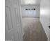 Bedroom with a large window letting in natural light and neutral carpet at 16472 W Tether Trl, Surprise, AZ 85387