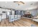 Spacious kitchen island with stainless steel appliances, open to the dining area at 16585 W Harrison St, Goodyear, AZ 85338