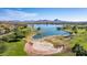 Beautiful aerial view of the community lake, park, and surrounding mountains at 16629 E Westby Dr, Fountain Hills, AZ 85268