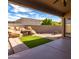 Outdoor living area with water feature, grass patch, and patio area at 16629 E Westby Dr, Fountain Hills, AZ 85268