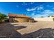 Dirt backyard with a block wall and a partial view of the house at 16629 E Westby Dr, Fountain Hills, AZ 85268